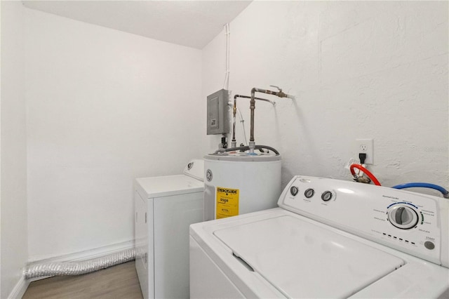 laundry room with wood-type flooring, water heater, and washing machine and clothes dryer