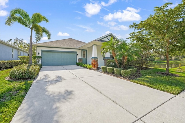 view of front of house with a water view and a garage