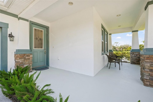 entrance to property with covered porch