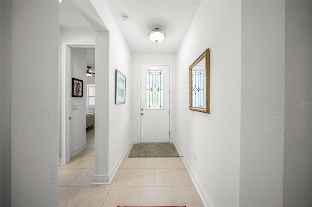 entryway featuring light tile patterned flooring