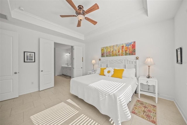 tiled bedroom with ensuite bath, a raised ceiling, ceiling fan, and ornamental molding