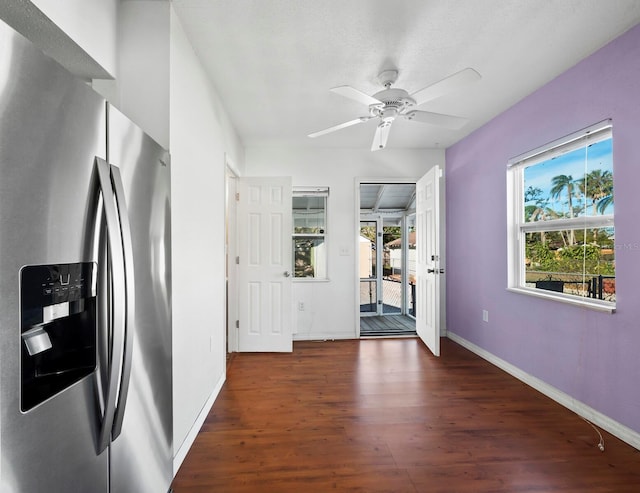 kitchen featuring stainless steel fridge with ice dispenser, plenty of natural light, dark wood-type flooring, and ceiling fan