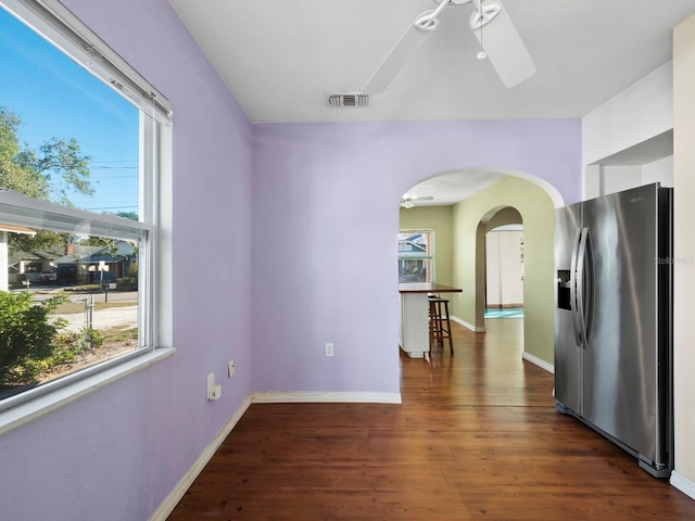 interior space with ceiling fan and dark wood-type flooring