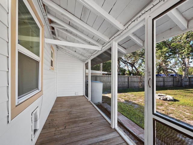 sunroom / solarium with vaulted ceiling with beams and wood ceiling