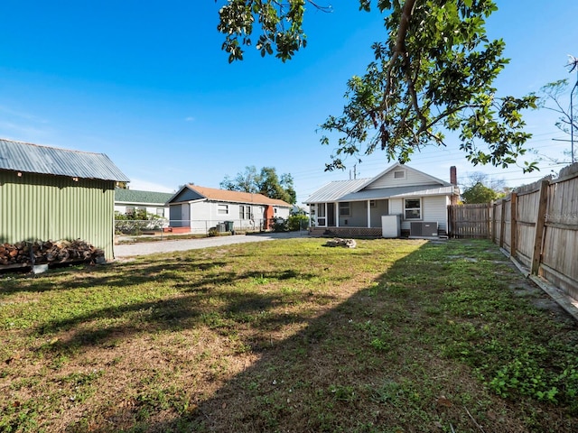 view of yard with central AC