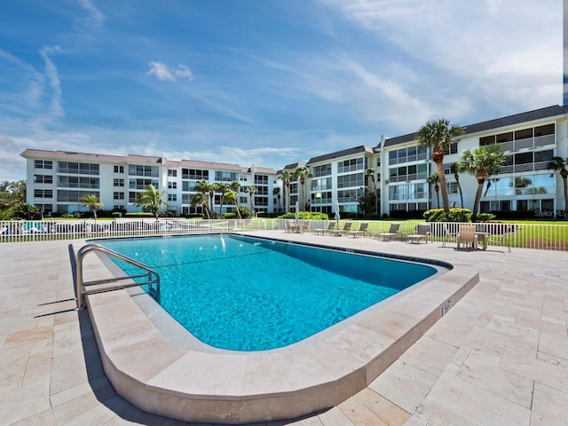 view of swimming pool featuring a patio area