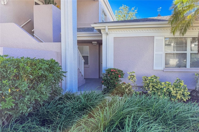 5697 Sheffield Greene Cir Unit 51, Sarasota, FL 34235 - view of exterior entry with stucco siding