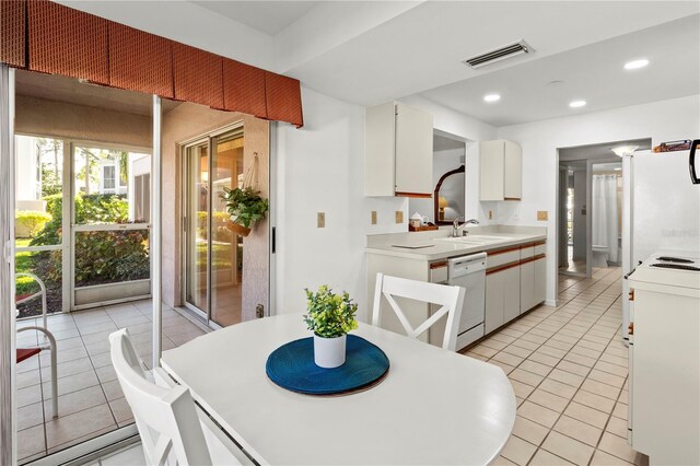 5697 Sheffield Greene Cir Unit 51, Sarasota, FL 34235 - dining space featuring light tile patterned floors and recessed lighting