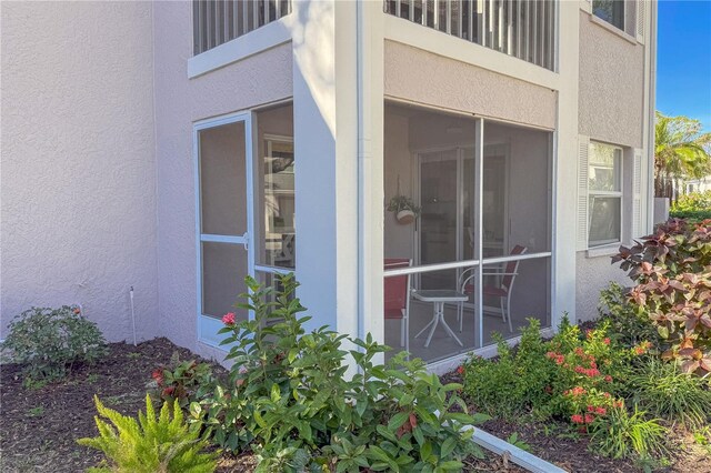 5697 Sheffield Greene Cir Unit 51, Sarasota, FL 34235 - view of home's exterior featuring stucco siding