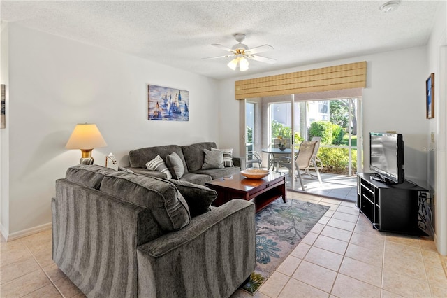 5697 Sheffield Greene Cir Unit 51, Sarasota, FL 34235 - living room with a ceiling fan, light tile patterned floors, and a textured ceiling