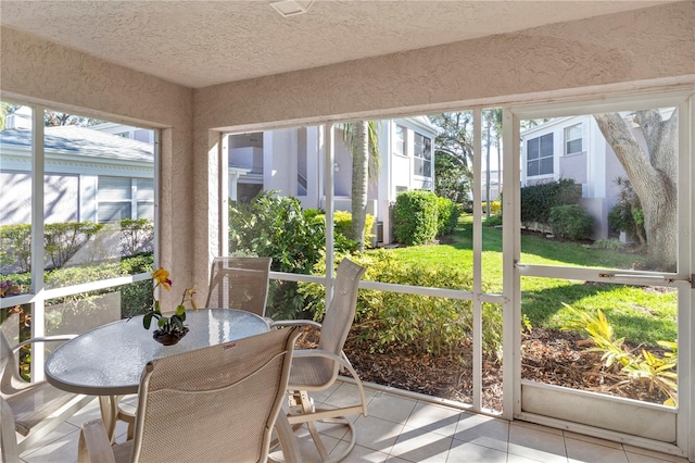 5697 Sheffield Greene Cir Unit 51, Sarasota, FL 34235 - sunroom / solarium featuring outdoor dining space