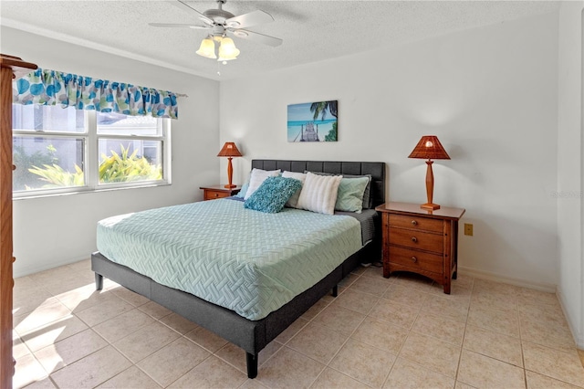 5697 Sheffield Greene Cir Unit 51, Sarasota, FL 34235 - bedroom with light tile patterned floors, a textured ceiling, and ceiling fan