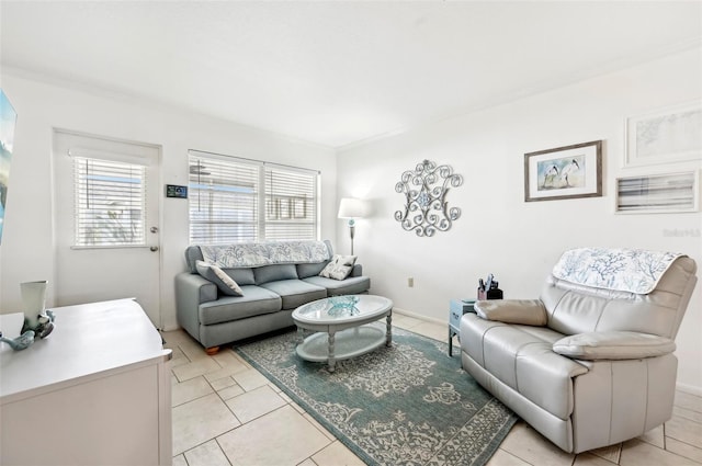 living room with crown molding and light tile patterned floors