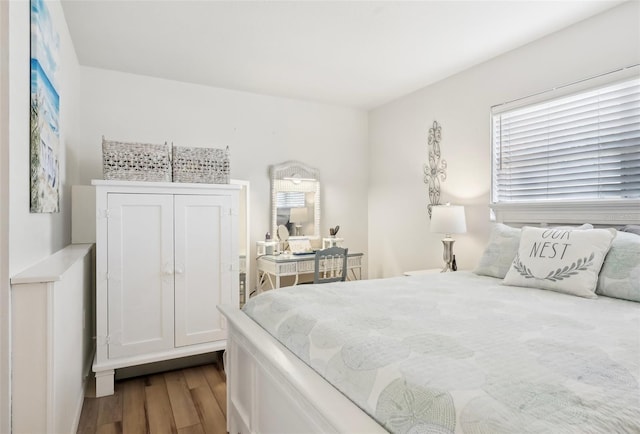 bedroom with hardwood / wood-style flooring