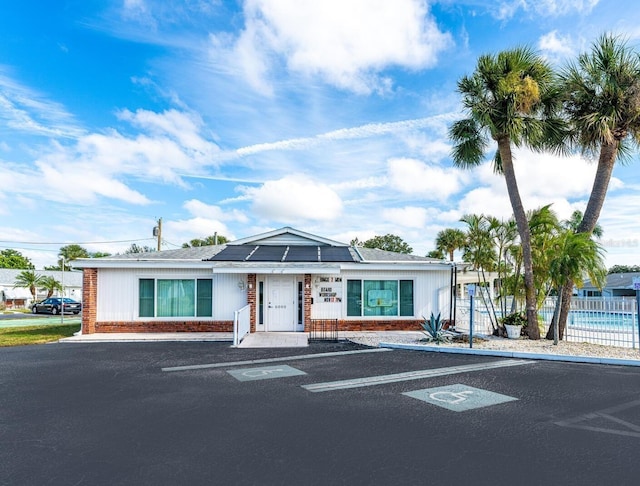 view of front of home featuring solar panels