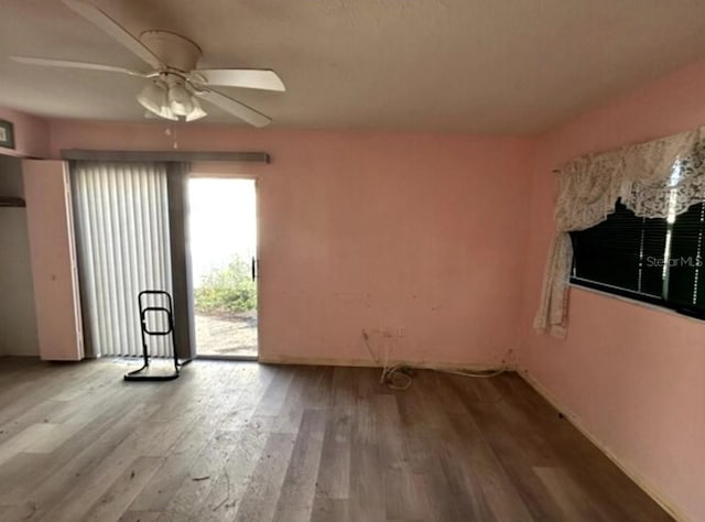 unfurnished room featuring ceiling fan and light hardwood / wood-style flooring