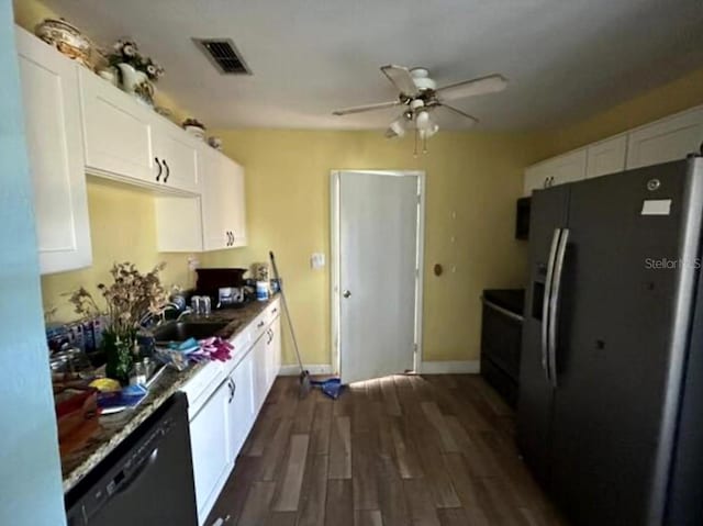 kitchen with white cabinets, stainless steel refrigerator with ice dispenser, black dishwasher, and sink