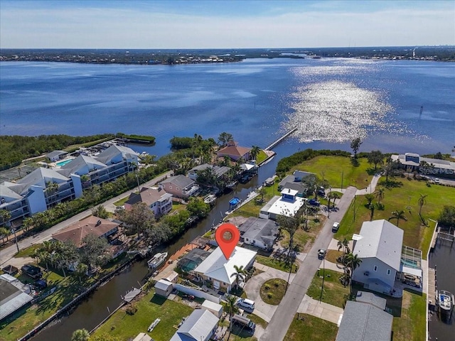 birds eye view of property with a water view