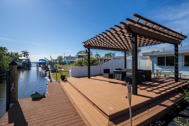 dock area with a water view and a pergola