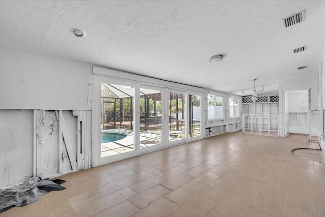 unfurnished living room with lofted ceiling