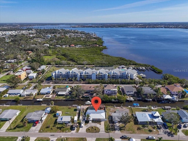 birds eye view of property featuring a water view