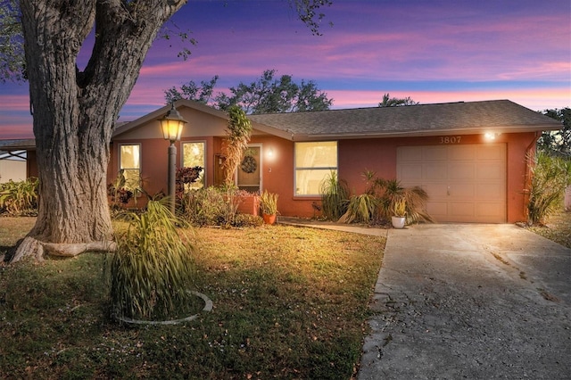 ranch-style house featuring a garage