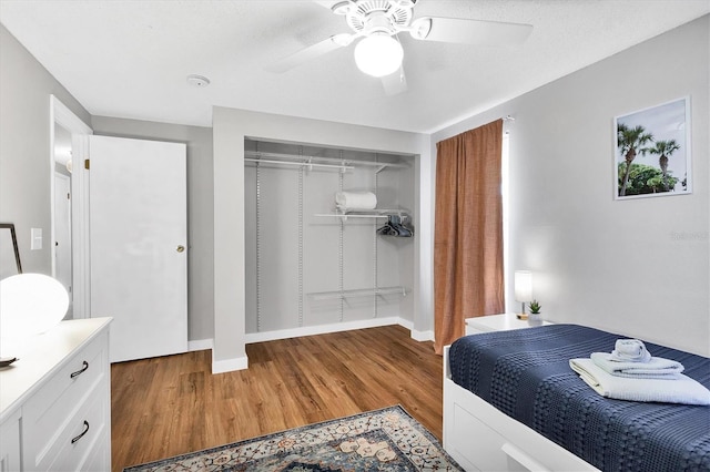 bedroom featuring a closet, ceiling fan, and light hardwood / wood-style floors