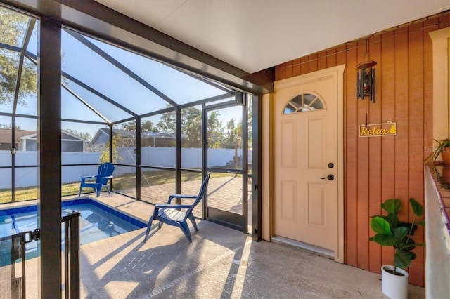 view of pool with a lanai and a patio