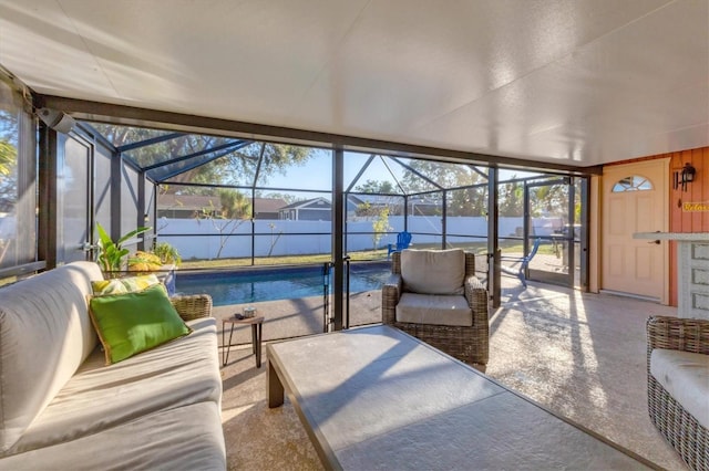 sunroom / solarium with plenty of natural light and a swimming pool