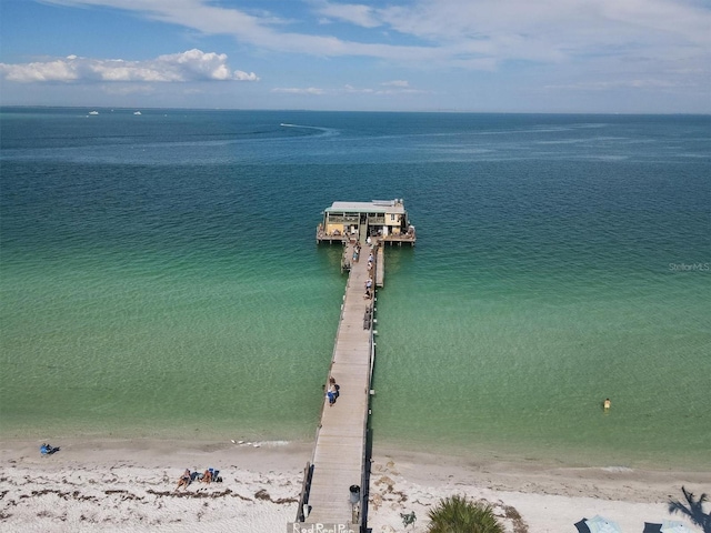 drone / aerial view featuring a view of the beach and a water view