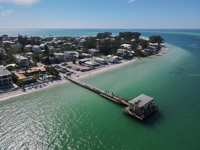 drone / aerial view with a water view and a beach view