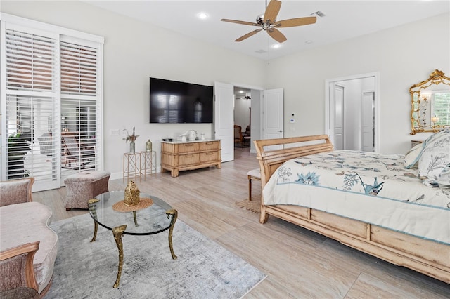 bedroom with light wood-type flooring and ceiling fan