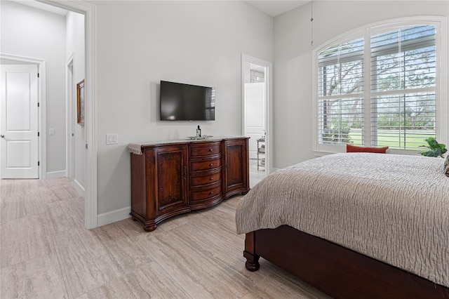 bedroom featuring multiple windows