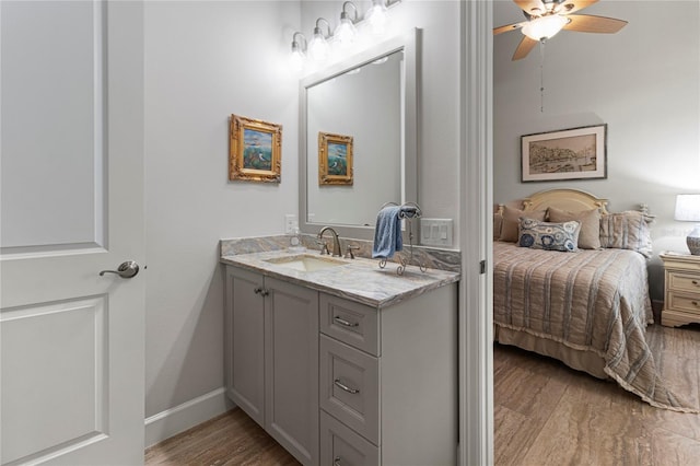 bathroom featuring vanity, hardwood / wood-style flooring, and ceiling fan