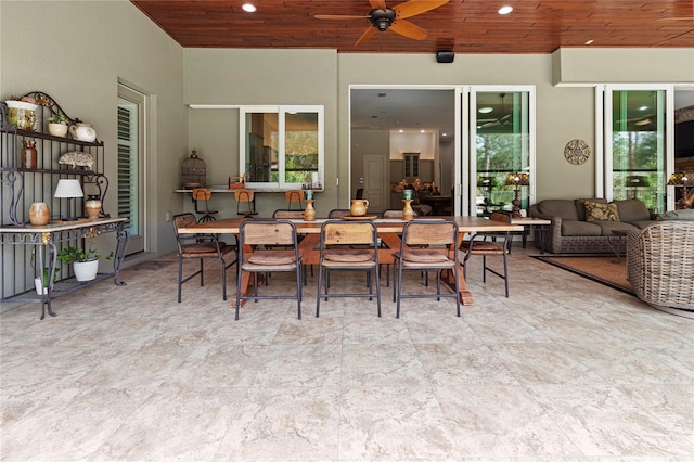 view of patio with ceiling fan and an outdoor living space