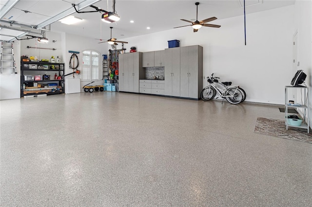 garage featuring ceiling fan and a garage door opener