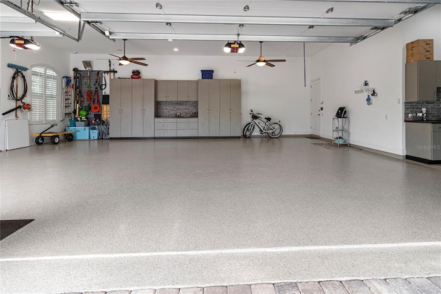 garage featuring ceiling fan and a garage door opener