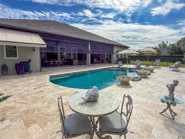 view of swimming pool featuring a patio