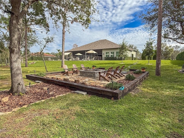 view of yard featuring an outdoor fire pit