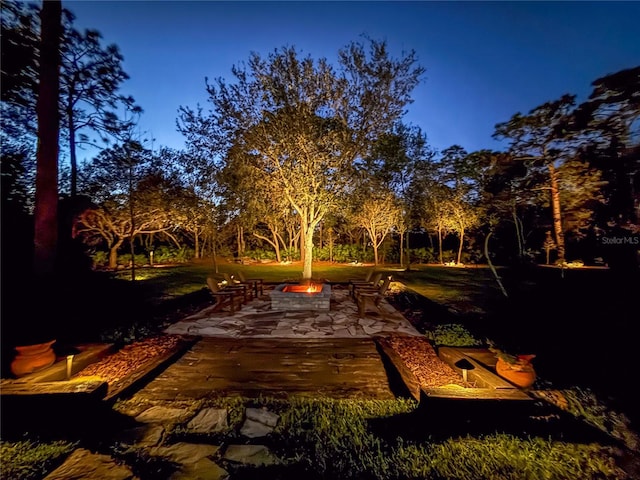 exterior space featuring a patio and an outdoor fire pit