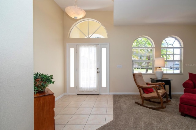 entryway featuring a wealth of natural light and light tile patterned flooring