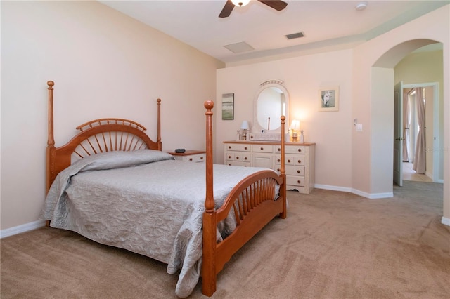 bedroom with ceiling fan and light carpet