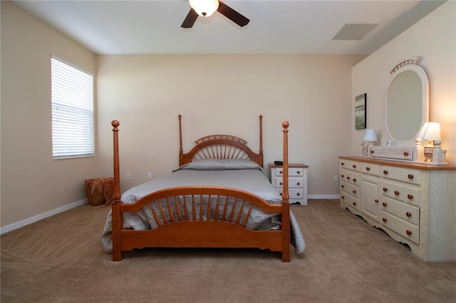 bedroom with ceiling fan and light colored carpet