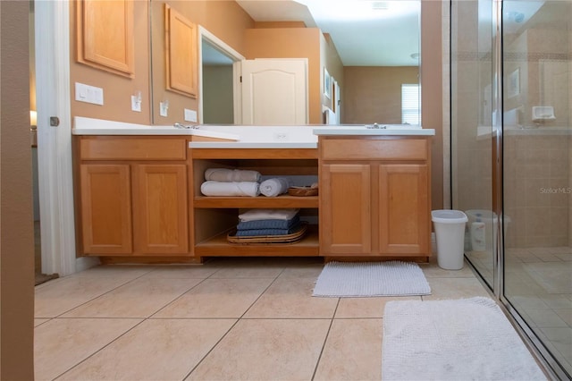 bathroom featuring tile patterned floors, vanity, and an enclosed shower