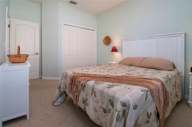 carpeted bedroom featuring a closet