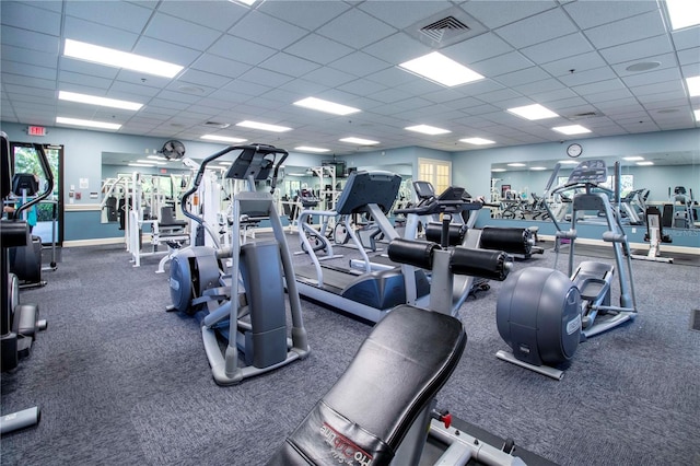 exercise room with a drop ceiling