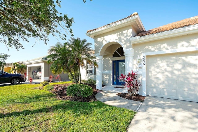 236 Golden Harbour Trl, Bradenton, FL 34212 - mediterranean / spanish home with stucco siding, a tile roof, a front lawn, and a garage