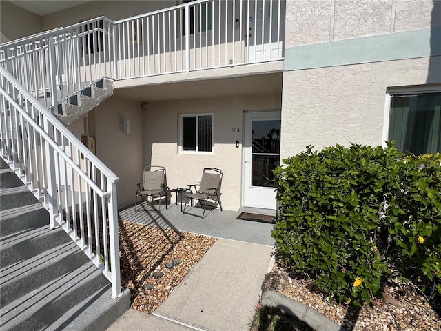 doorway to property featuring a patio area