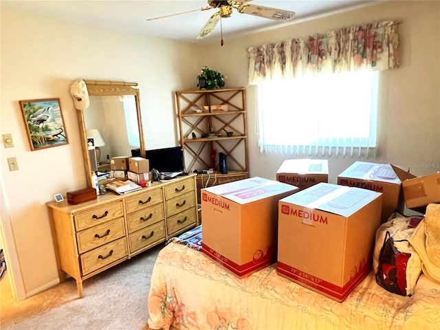 bedroom with ceiling fan and light colored carpet