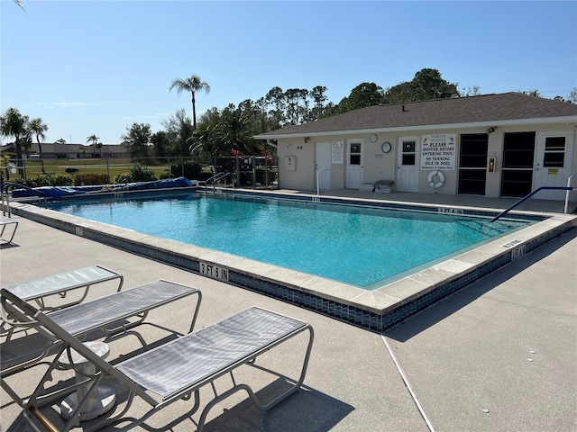 view of swimming pool featuring a patio